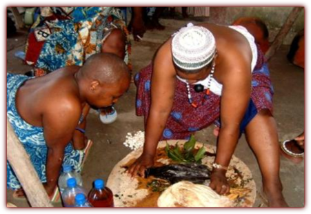 Mama Zogbe in Ceremony with Initiate. 
